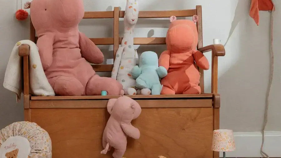 Colorful Maileg plush toys displayed on a wooden bench, perfect for inspiring children's imagination.